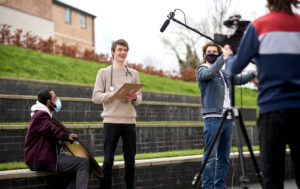 Photo of a students using film making equipment