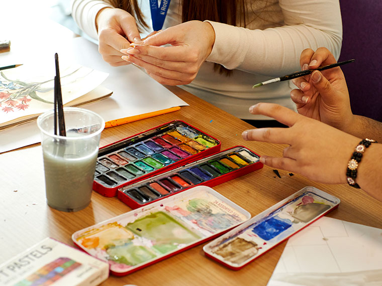A close up of paints and brushes