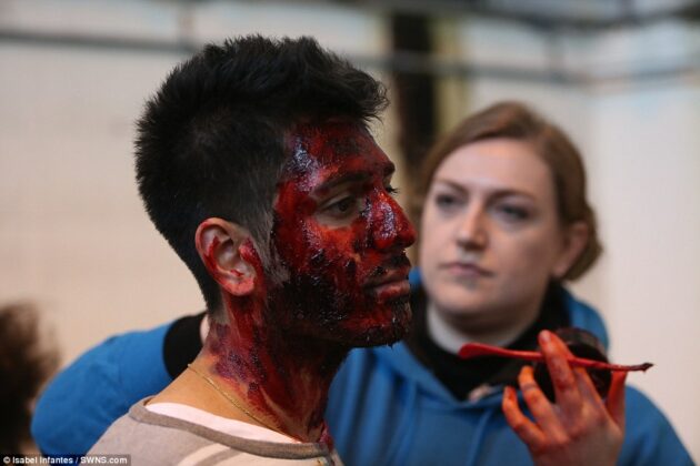 model having dmake up applied to simulate facial injuries