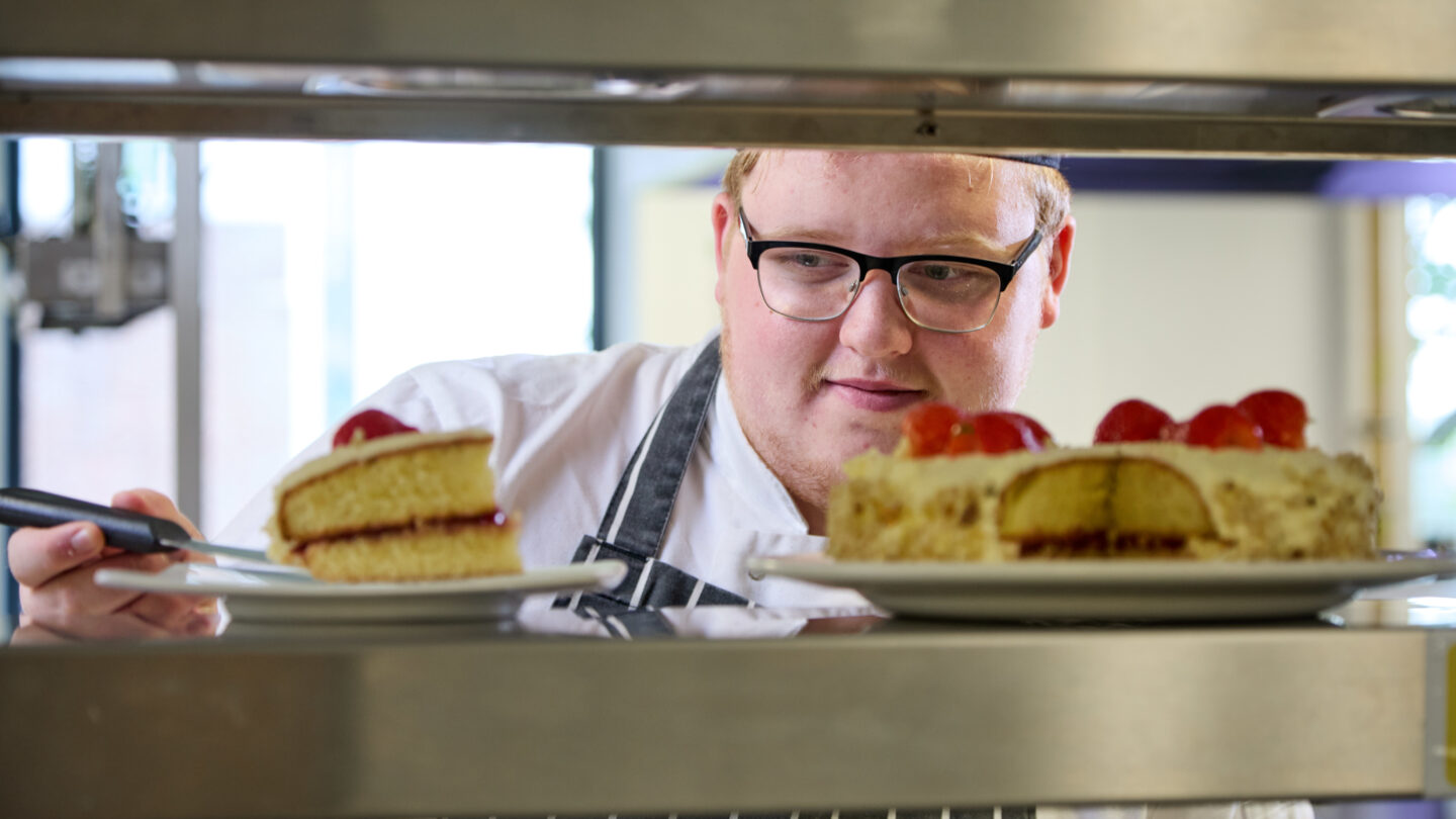 catering student serving cake