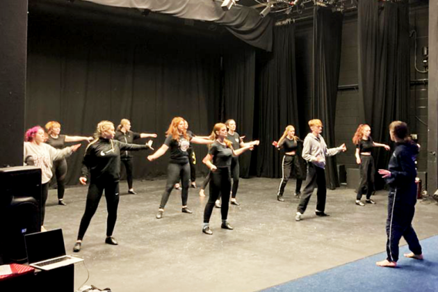 Musical theatre studets taking instruction during their dance workshop