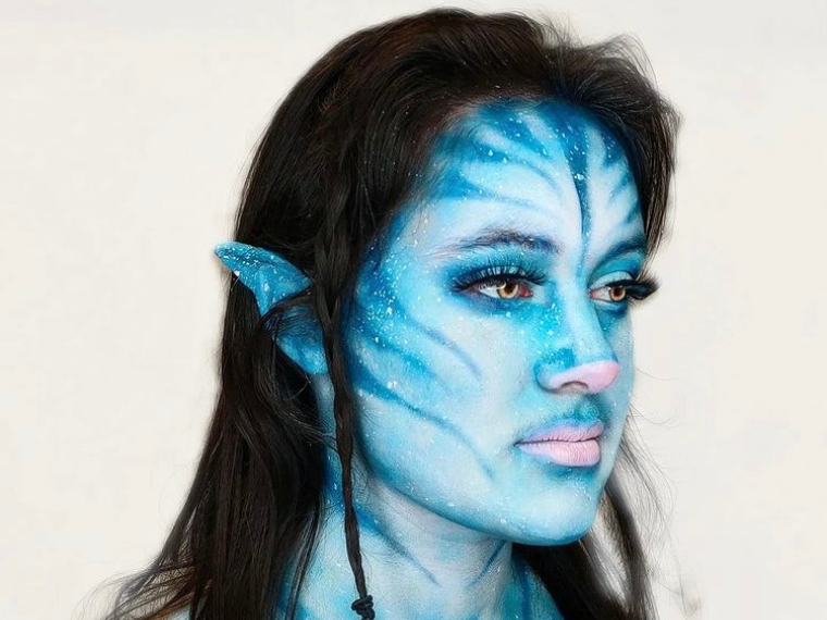 Fantasy 'alien' make up applied to models face