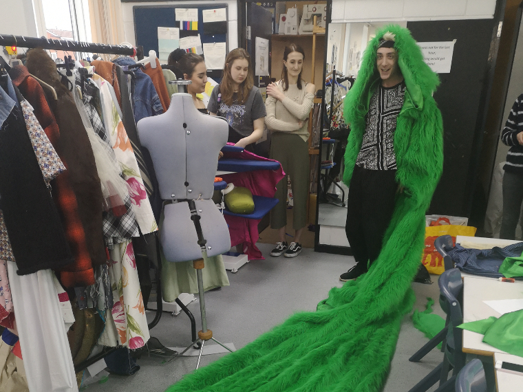 Fashion students working on costumes