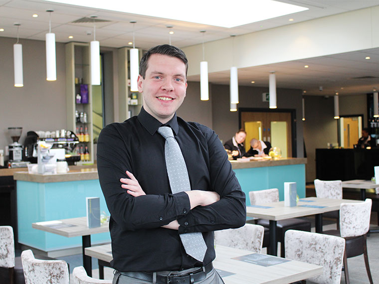 Nick stands with folded arms in the Wharncliffe restaurant.