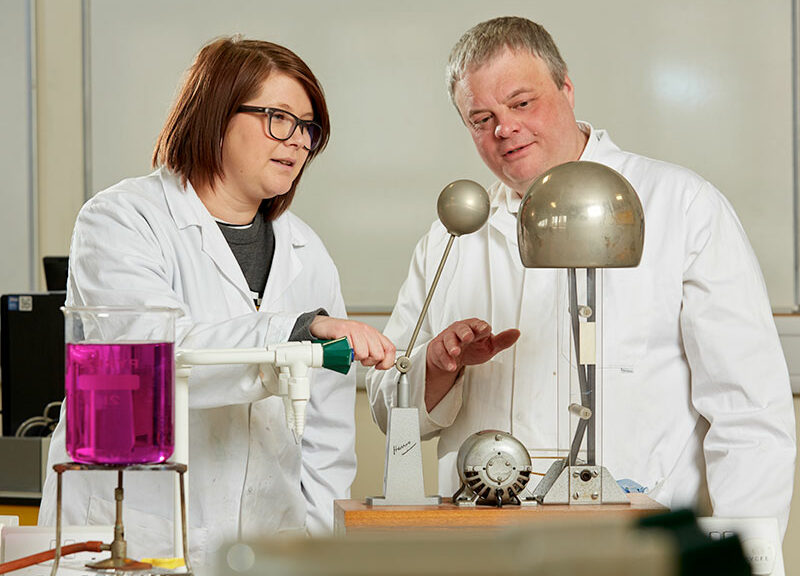 Two people using scientific equipment