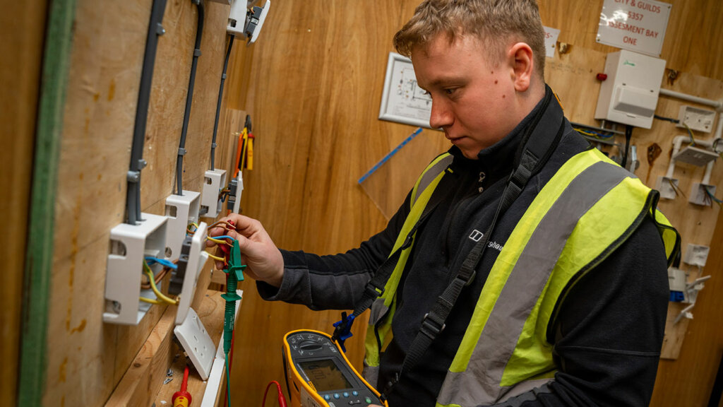 An electrical installation student
