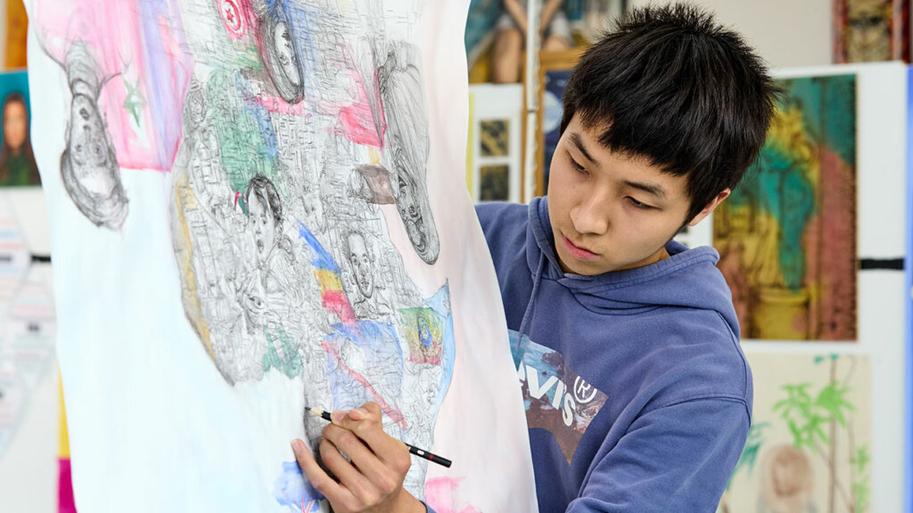 Image of an art student drawing