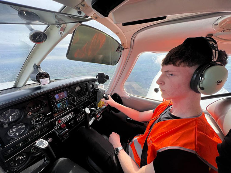 A student flying a plane on our aviation course