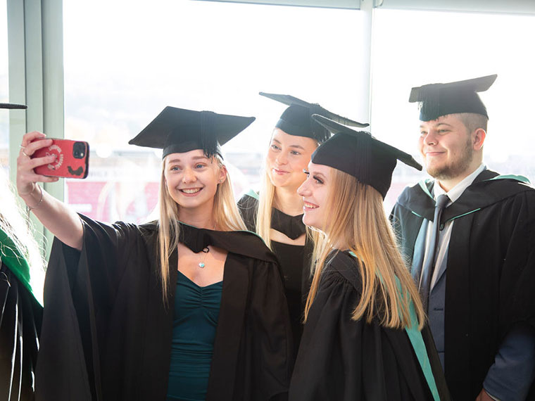 Students taking photos at the graduation celebrations