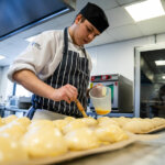 A student working in The Wharncliffe kitchen