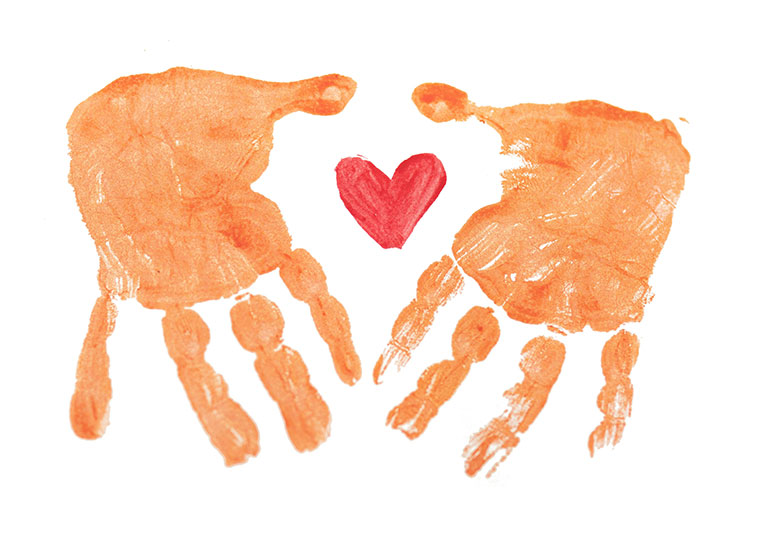 Hand print paints with a heart shape