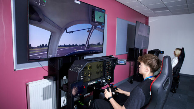 A student using the aviation simulator