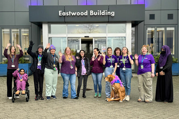Staff stood outside the Eastwood Building at Rotherham College's Wear It Purple day