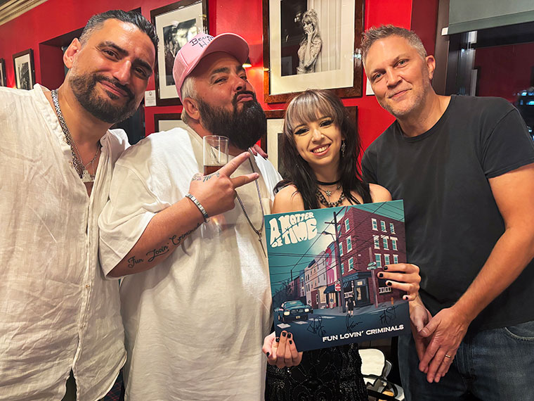 Graphic designer Macy Beddows with Fun Lovin' Criminals (from left) Naim Cortazzi, Frank Benbini and Brian Leiser at the "A Matter of Time" album launch party at Canary Wharf in London