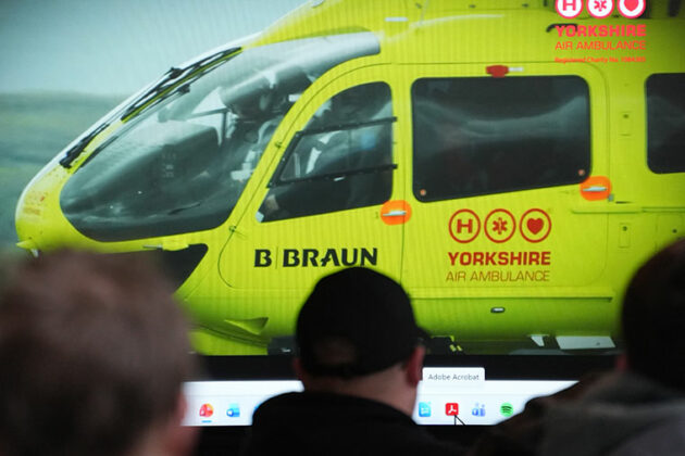 An air ambulance being shown on a big screen to students